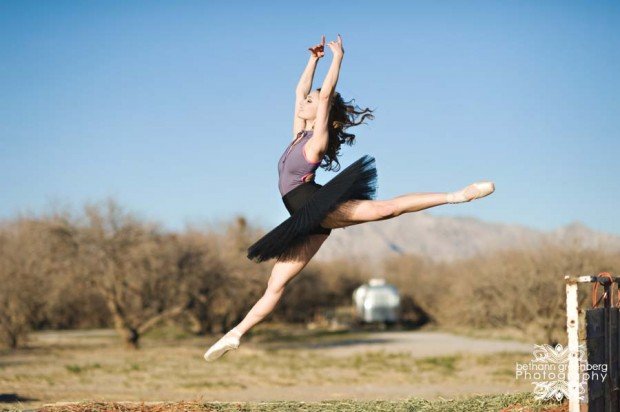 A ballerina leaps into the air