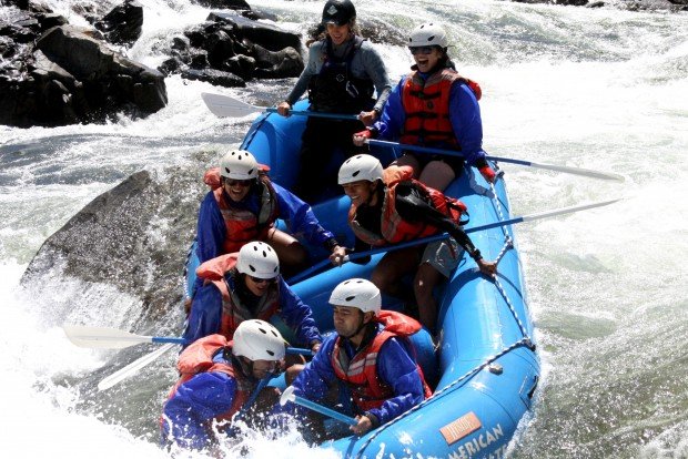 A group hits the rapids on their Amwerican Whiterwater Expedition in Coloma, CA