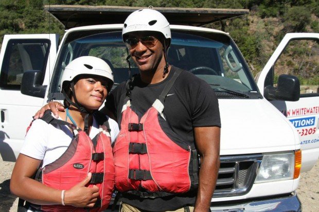 A man and a woman prepare to head out for an American Whitewater Expedition a few hours from Lake Tahoe.