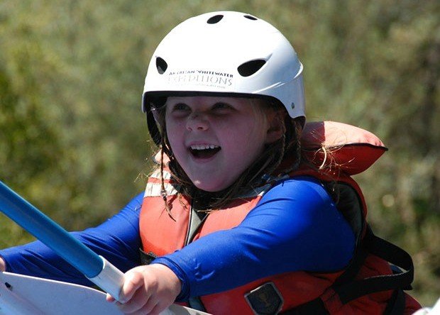 Young Girl enjoying a rafting adventure